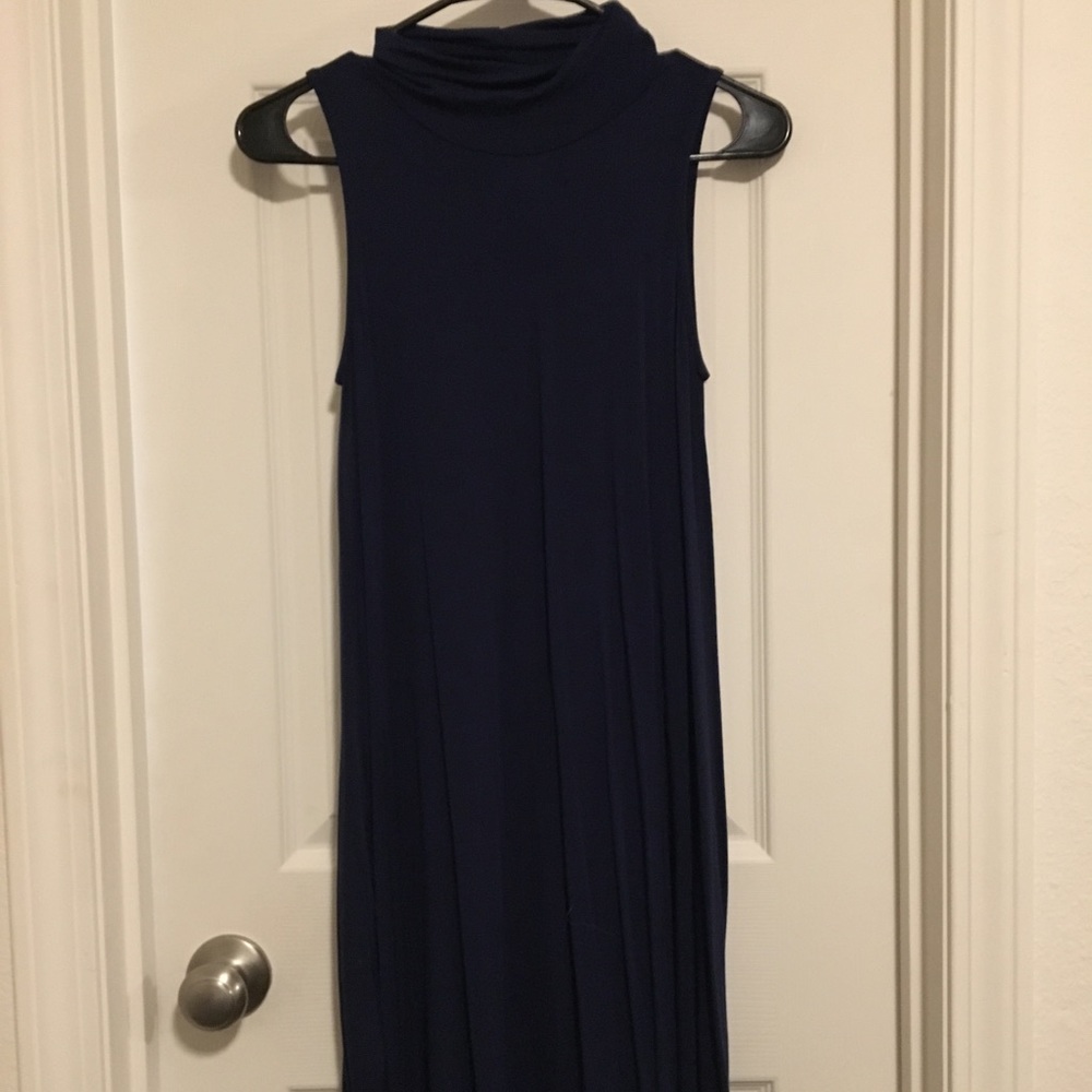 This is a Navy High Neck Alya Dress. Never worn.